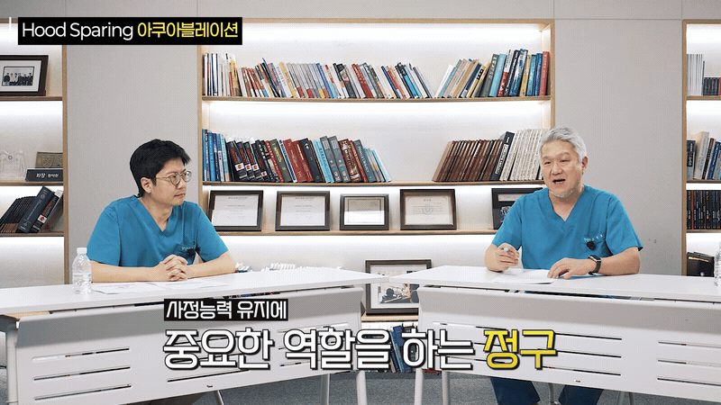 Doctor actively gesturing to explain anatomical preservation technique